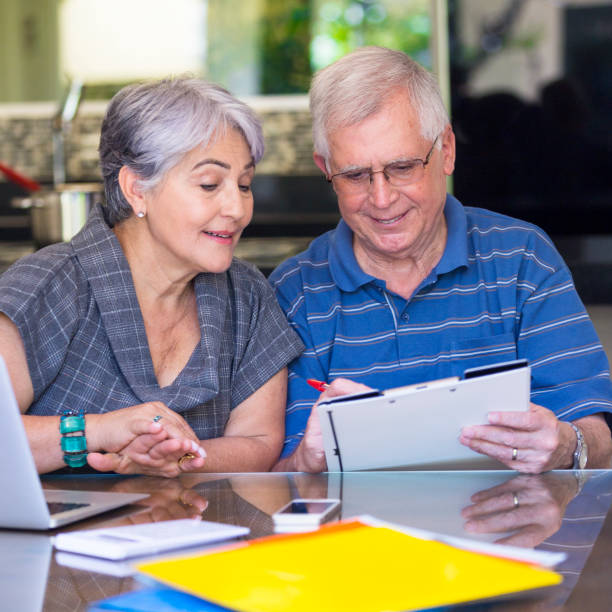 istock Senior Brazilian couple working at home 859937340