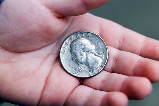 istock American coin in hand 859937360