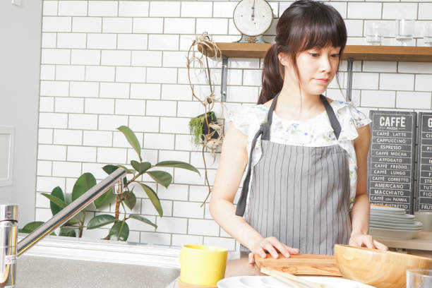istock Cooking young woman 859943098