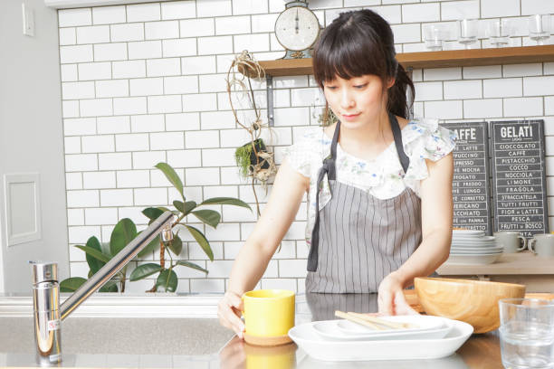 istock Cooking young woman 859943108
