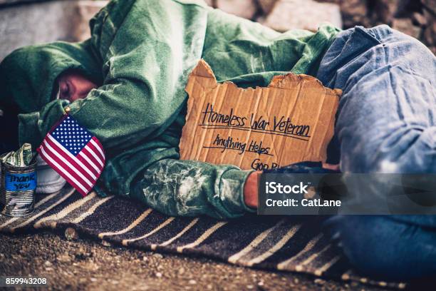 Fighting Adversity Homeless War Veteran Sleeping With Sign And Money Tin Stock Photo - Download Image Now