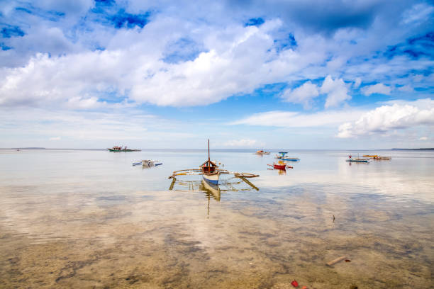 istock Philippines fishing boats reflection 859943460