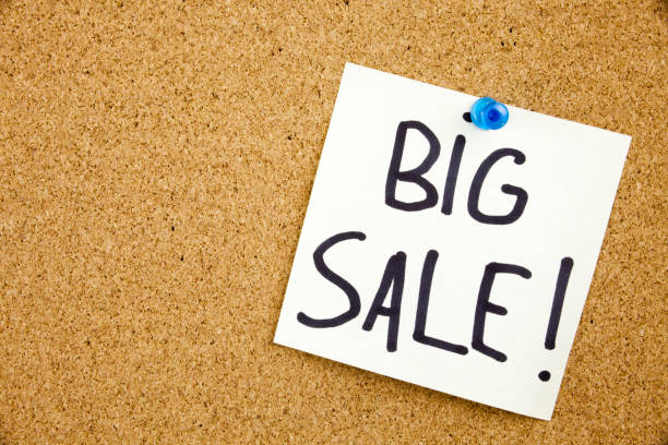 istock A yellow sticky note writing, caption, inscription Phrase BIG SALE in black ext on a sticky note pinned to a cork notice board 859944358