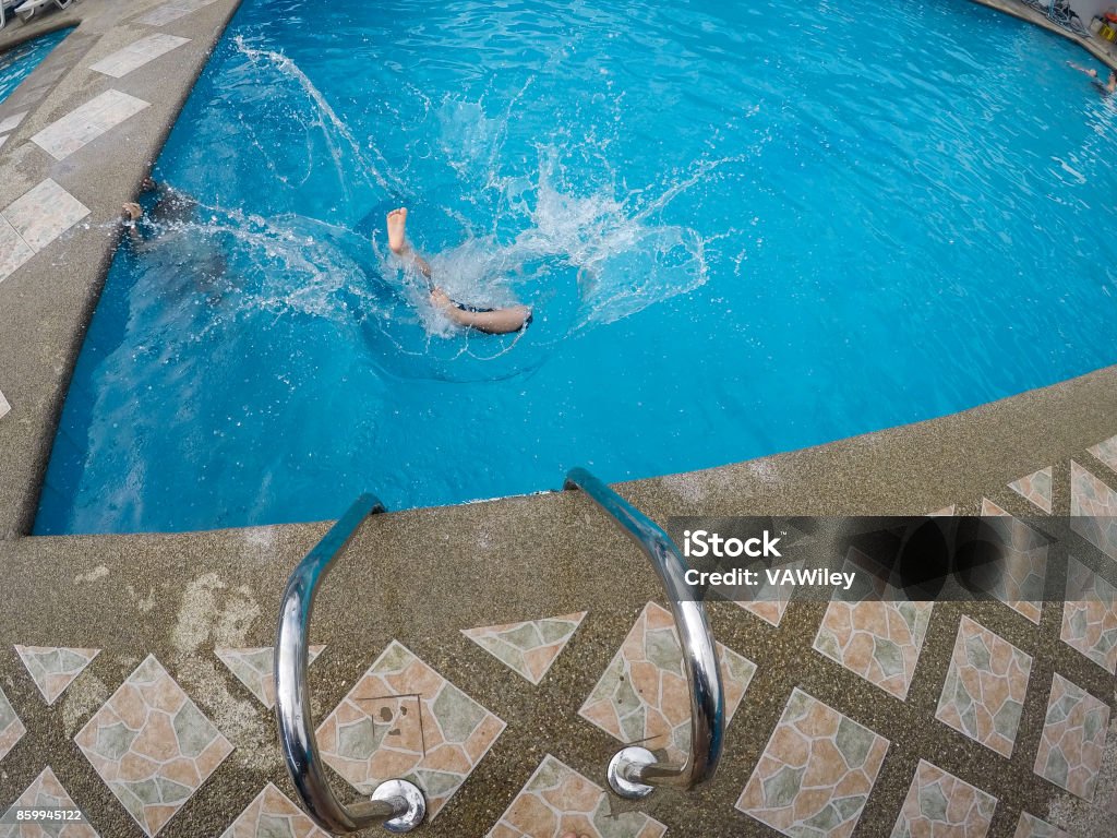 Falling In The Pool Child Falling Into A Pool Stock Photo - Download Image Now - Active ...