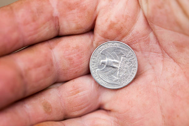 istock American coin in hand 859955196