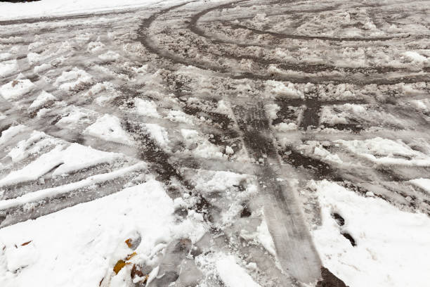 istock traces of the car on snow 859962814
