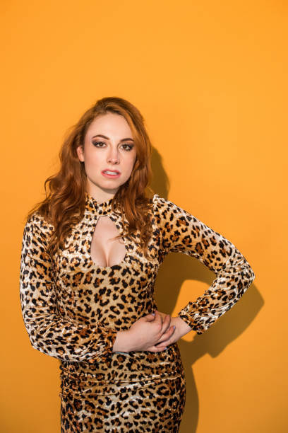 istock Monochrome - Leopard Woman on Orange Background 859983440
