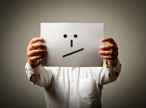 istock Man is holding white paper with smile. Undecided and uncertain concept. 859991010