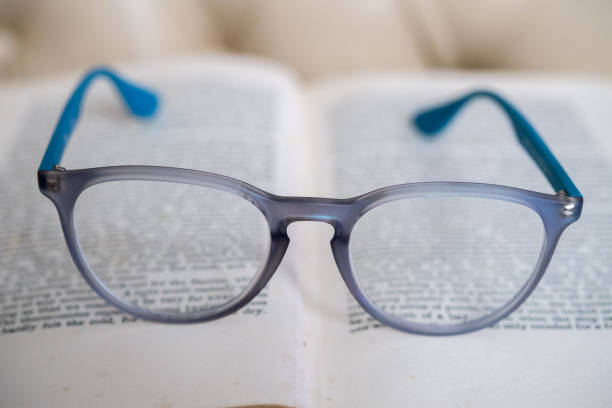 istock light blue reading glasses isolated on a book 859995716