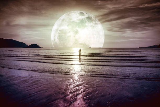 istock Super moon. Colorful sky with cloud and bright full moon over seascape. 859995804