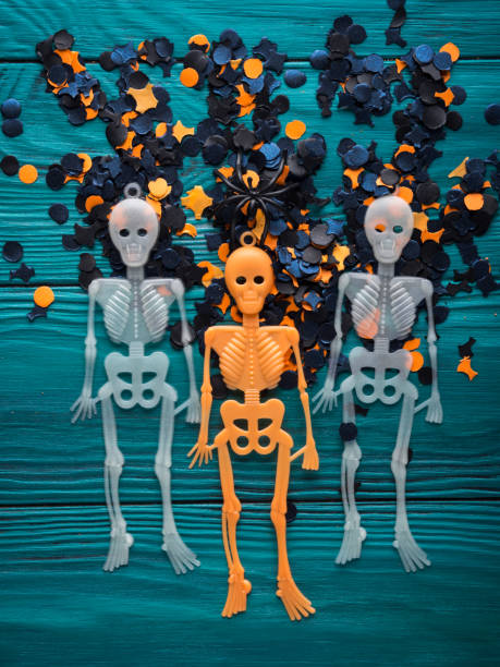 istock Halloween party decorations skeleton on dark green 860000594