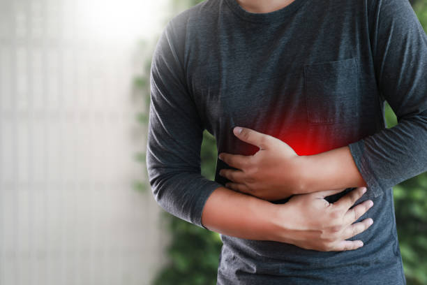 istock MAN with symptomatic acid reflux , suffering from acid reflux 860005250