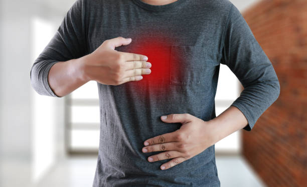 MAN with symptomatic acid reflux , suffering from acid reflux MAN with symptomatic acid reflux , suffering from acid reflux heartburn photos stock pictures, royalty-free photos & images