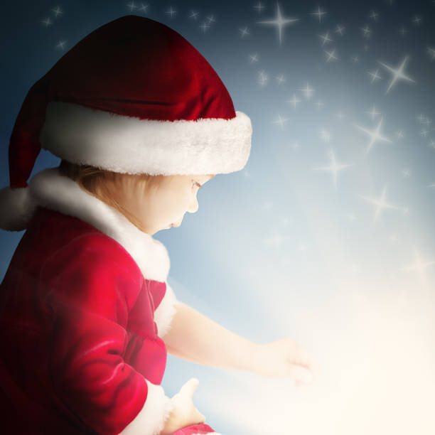 istock Christmas Child Open Gift on Background with Sparkle and Glitter 860005354