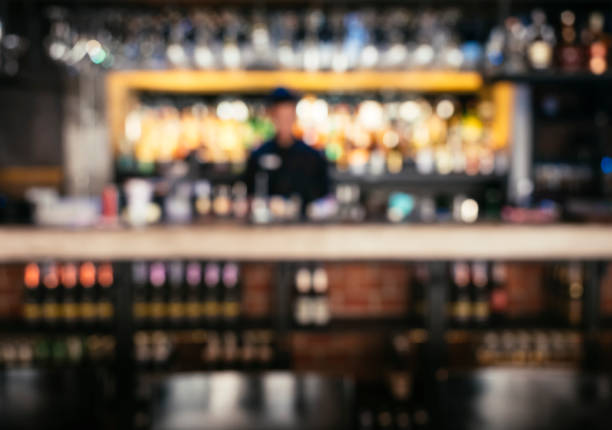 istock Bartender with blur Bar shelf background Nightlife 860008364