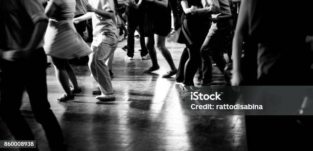 Bottom View Of People Legs Dancing In Black And White Stock Photo - Download Image Now