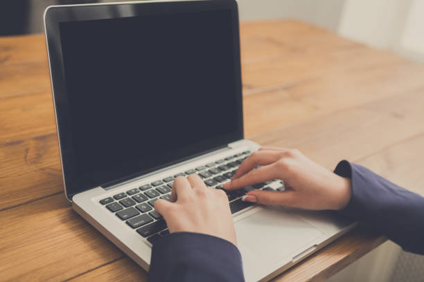 istock Business woman using laptop at workplace, close-up 860012850
