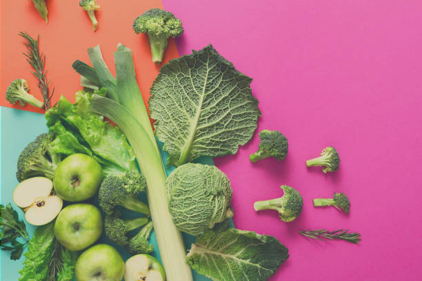 istock Flat lay of green vegetables on bright background 860013698