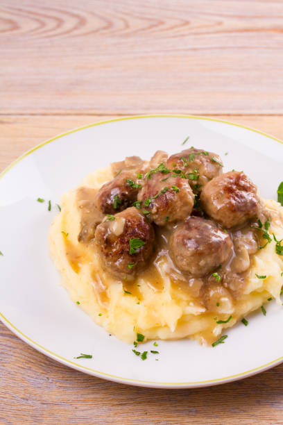 istock Beef meatballs with mushroom gravy on mashed potato 860013780