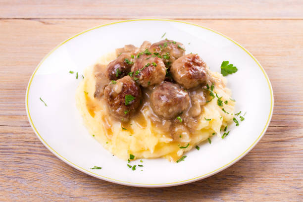 istock Beef meatballs with mushroom gravy on mashed potato 860014078