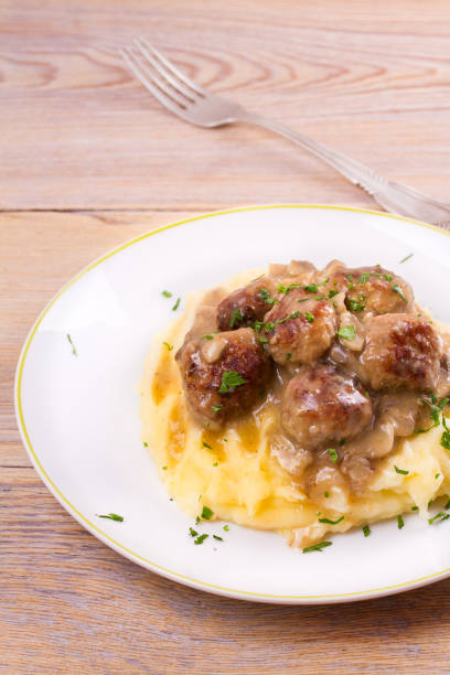 istock Beef meatballs with mushroom gravy on mashed potato 860017046