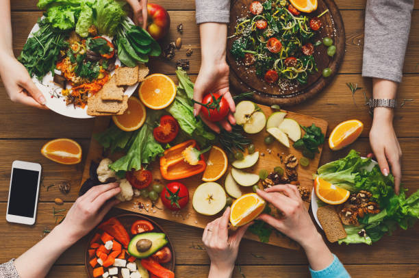 Dinner table, women eat healthy food at home kitchen