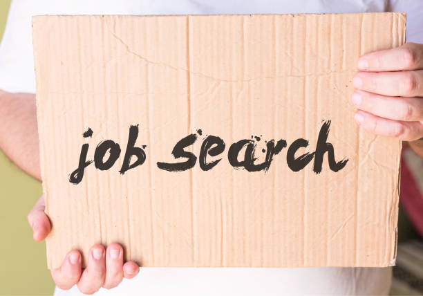 istock job search on cardboard in hands man 860033254