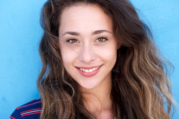 istock Close up young beautiful woman smiling 860035626