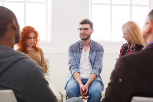 istock Meeting of support group, therapy session 860035646
