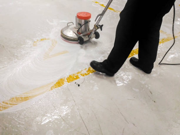 istock worker cleaning and polishing floor 860035790