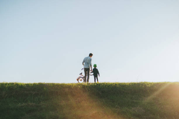 istock Father and son on a bicycle lane 860035822