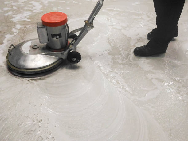 istock worker cleaning and polishing floor 860036184