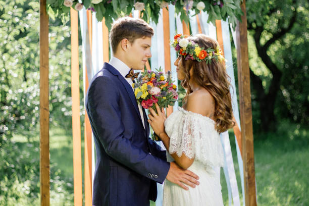 istock Beautiful wedding couple - bride and groom during wedding ceremony 860036432