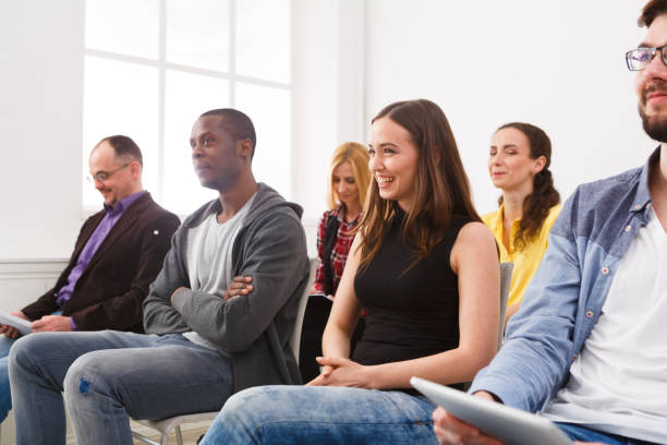 istock Group of people sitting at seminar, copy space 860037236