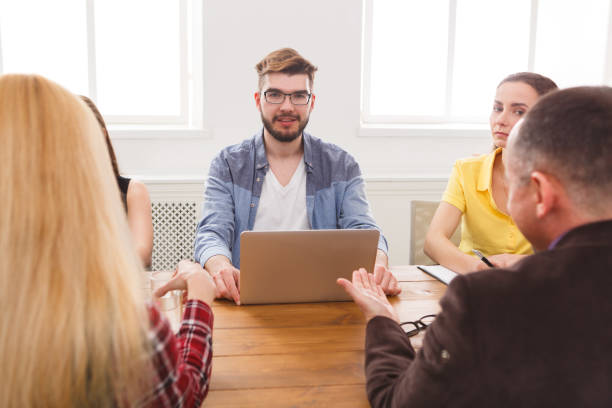 istock Business meeting. Young team in modern office 860039574