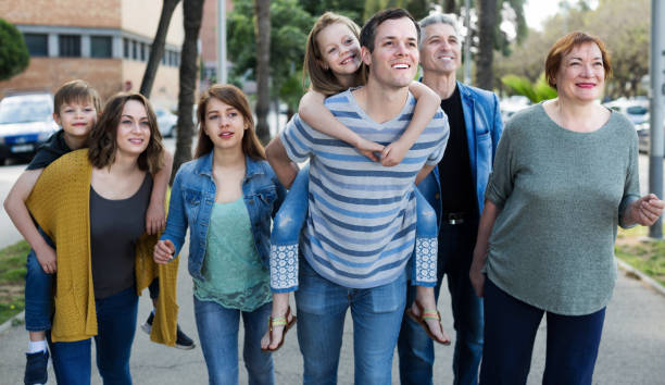 istock Friendly and glad family with kids going in the park 860039730