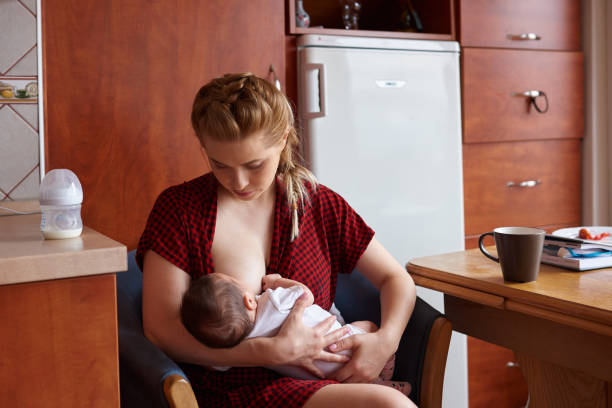 istock hungry baby girl breasfeeding 860039918