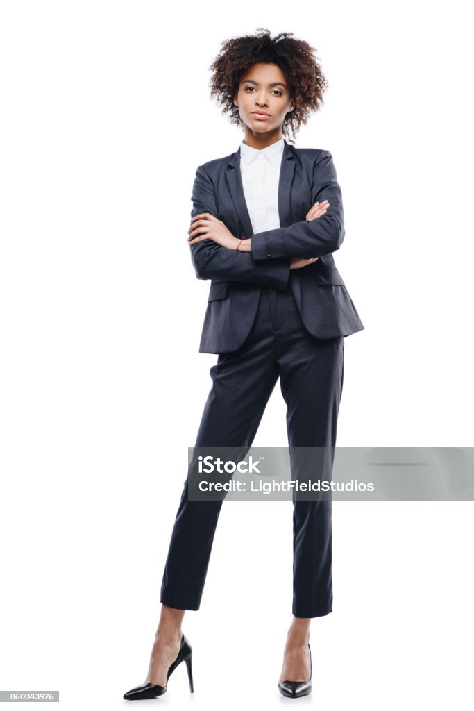 businesswoman with crossed arms attractive african american businesswoman in suit with crossed arms, isolated on white Women Stock Photo