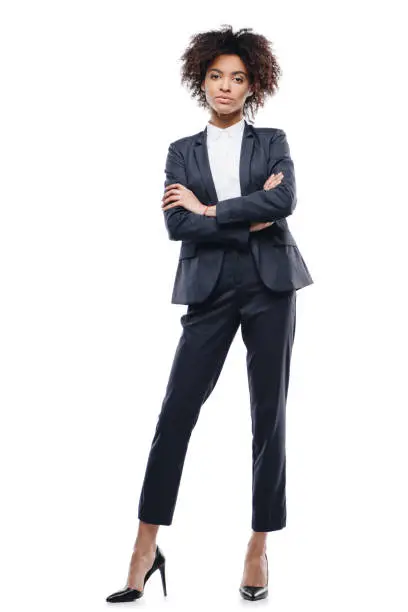 attractive african american businesswoman in suit with crossed arms, isolated on white
