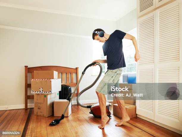Moving In Got Him In Such A Mood Stock Photo - Download Image Now - Cleaning, Vacuum Cleaner, Men