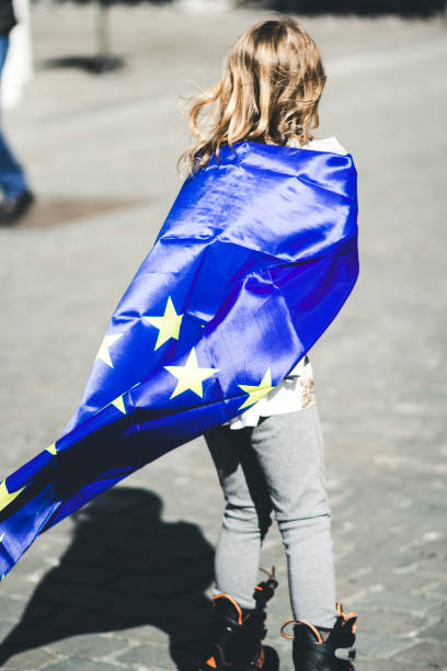 istock blonde 10 year old with EU flag and inline skates 860047962