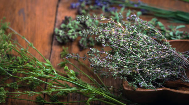 istock fresh kitchen herbs and spices on wooden table. Top view 860048398