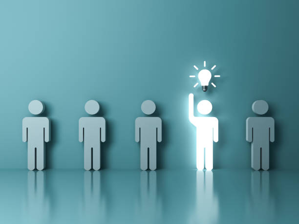 Stand out from the crowd and different concept , One glowing light man raising his hand got an idea bulb among other people on light green pastel color background with reflections . 3D rendering stock photo