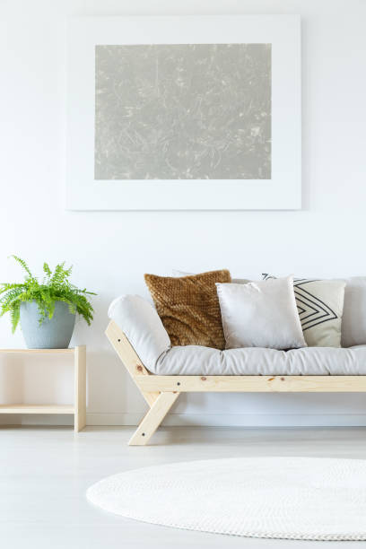 istock Painting above grey chaise lounge 860049174