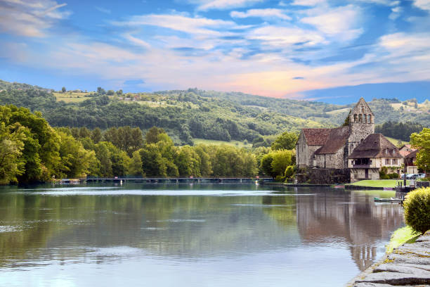 Beaulieu on Dordogne. The river and the chapel of the penitents, Corrèze. New Aquitaine stock photo