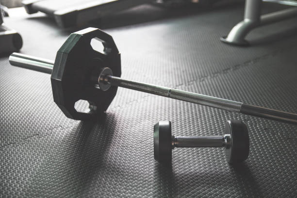 istock Gym background.Barbell and Dumbbell 860056508