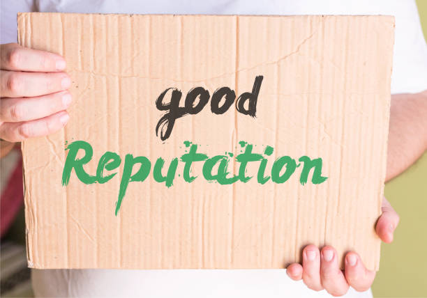 istock good reputation on cardboard in hands man 860056548