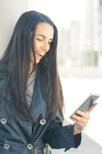 istock Beautiful girl smiling on the phone 860058054