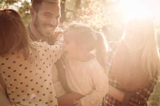istock Family together in meadow. 860064304