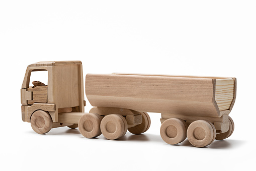 Wooden toy truck isolated on white background. 3d illustration.